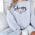 Stronger Than The Storm Graphic Sweatshirt STYLE SOURCE